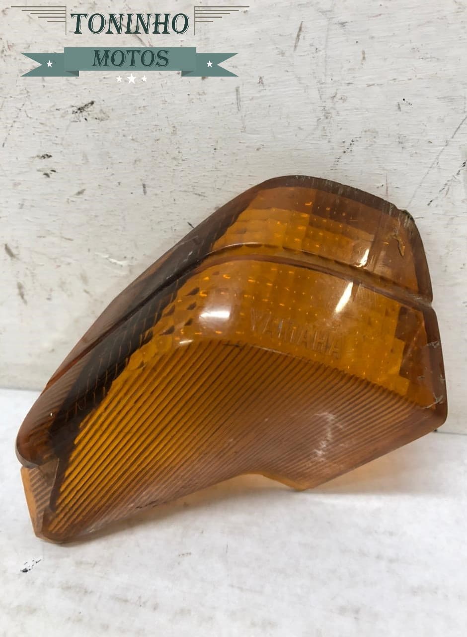 LENTE PISCA TRASEIRO ESQUERDO YAMAHA CRYPTON 105 1998 Á 2004
