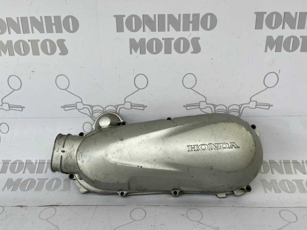 TAMPA DO MOTOR LADO ESQUERDO HONDA LEAD 2010 Á 2015