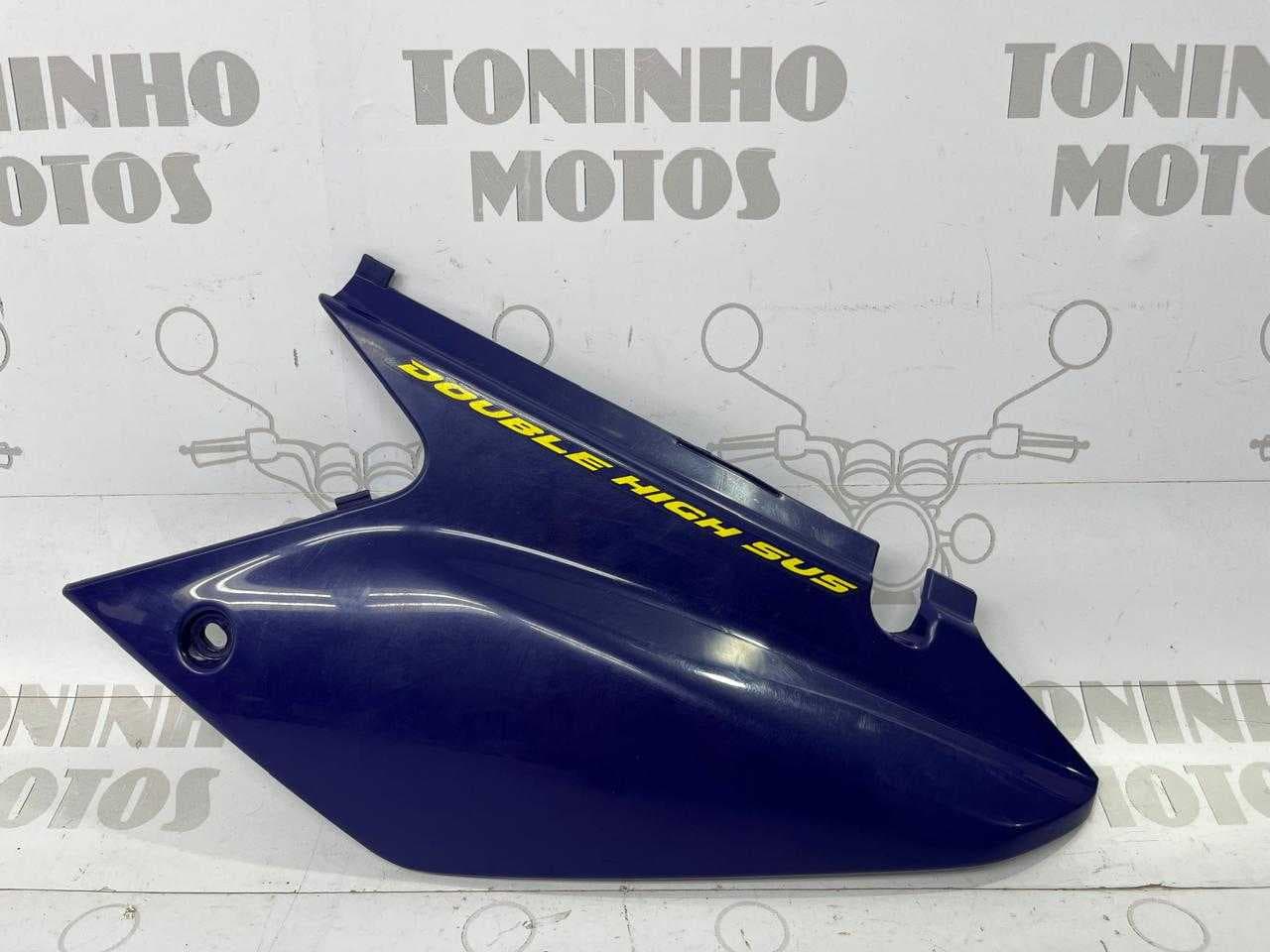 TAMPA LATERAL TRASEIRO ESQUERDO HONDA TORNADO 2005