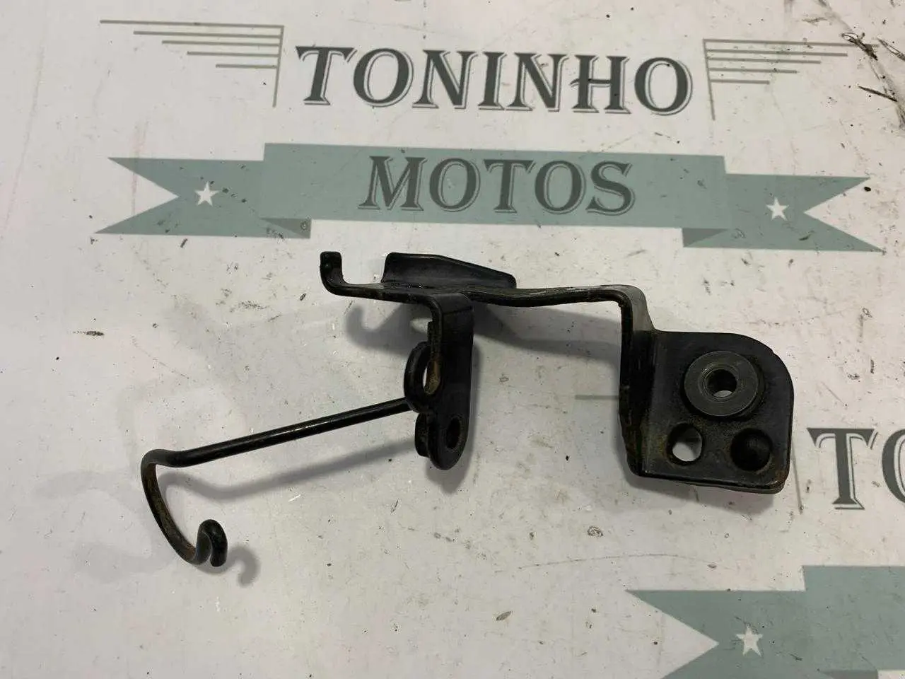 SUPORTE FAROL / PISCA DIANTEIRO DIREITO HONDA BROS 125 2003