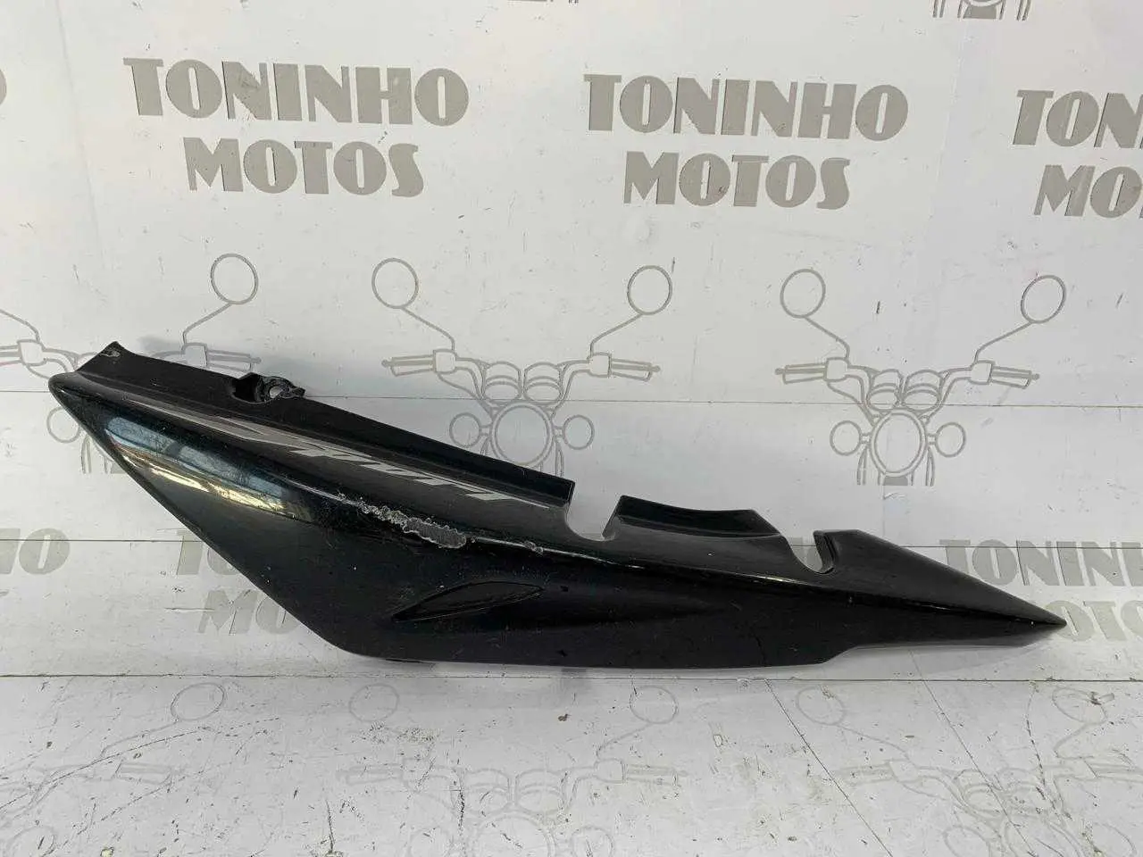 RABETA LATERAL LADO ESQUERDO HONDA TITAN 150 SPORT 2005